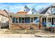 Charming blue house with brick details and a welcoming front porch at 1745 S Talbott St, Indianapolis, IN 46225