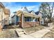 Nice curb appeal with a blue exterior, brick base and steps leading to the porch at 1745 S Talbott St, Indianapolis, IN 46225