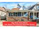 Charming home featuring a brick foundation, inviting front porch, and classic architectural details at 1745 S Talbott St, Indianapolis, IN 46225