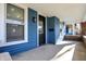 Inviting front porch with blue siding and brick accents at 1745 S Talbott St, Indianapolis, IN 46225
