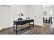 Home office with a desk, chair, and view into a dining area at 1745 S Talbott St, Indianapolis, IN 46225