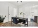 Home office with built-in desk and access to a full bathroom at 1745 S Talbott St, Indianapolis, IN 46225