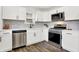 Updated kitchen, white shaker cabinets, stainless steel appliances at 1745 S Talbott St, Indianapolis, IN 46225