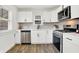 Renovated kitchen with white cabinets and stainless steel appliances at 1745 S Talbott St, Indianapolis, IN 46225