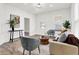 Bright and airy living room featuring hardwood floors and comfortable seating at 1745 S Talbott St, Indianapolis, IN 46225