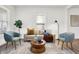Living room with hardwood floors, comfortable seating and stylish decor at 1745 S Talbott St, Indianapolis, IN 46225
