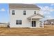 Exterior rear of a two-story home with white siding and a covered porch at 1845 James Pierce Dr, Shelbyville, IN 46176