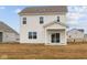 Exterior rear of a two-story home with white siding and sliding glass doors to the porch at 1845 James Pierce Dr, Shelbyville, IN 46176