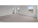 Spacious bedroom with plush carpet, neutral walls, and view to the outdoors at 1845 James Pierce Dr, Shelbyville, IN 46176