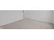 A bright, carpeted bedroom features white walls, trim and neutral-toned flooring at 1845 James Pierce Dr, Shelbyville, IN 46176