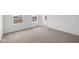 Sun-drenched bedroom featuring neutral carpeting, crisp white walls, and bright natural light at 1845 James Pierce Dr, Shelbyville, IN 46176