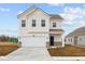 Charming two-story home with a two car garage and manicured front lawn at 1845 James Pierce Dr, Shelbyville, IN 46176