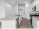 Modern kitchen with stainless steel appliances, a kitchen island, and white cabinets at 1845 James Pierce Dr, Shelbyville, IN 46176