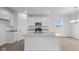 Bright kitchen featuring white cabinetry, stainless appliances, and gray countertops at 1845 James Pierce Dr, Shelbyville, IN 46176