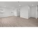 Bright living room with hardwood floors and two windows, offering ample natural light at 1845 James Pierce Dr, Shelbyville, IN 46176