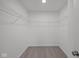 Walk-in closet featuring wall-mounted storage racks and neutral carpeting at 1845 James Pierce Dr, Shelbyville, IN 46176
