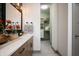 Modern bathroom with a double vanity, large mirror, and walk-in closet at 20027 Old Dock Rd, Westfield, IN 46074