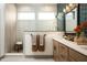 Double vanity bathroom with a walk-in shower and hexagonal tile at 20027 Old Dock Rd, Westfield, IN 46074