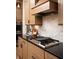 Gas cooktop with griddle and marble backsplash at 20027 Old Dock Rd, Westfield, IN 46074
