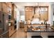 Modern kitchen with island, stainless steel appliances, and light wood cabinets at 20027 Old Dock Rd, Westfield, IN 46074