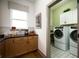 Convenient laundry room with washer, dryer, and ample cabinetry at 20027 Old Dock Rd, Westfield, IN 46074