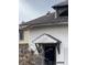 White house with damaged door and porch at 2364 Shelby St, Indianapolis, IN 46203