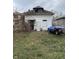 White house with a gabled roof and yard at 2364 Shelby St, Indianapolis, IN 46203