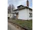 White house needing repairs, brick chimney at 2364 Shelby St, Indianapolis, IN 46203