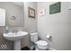 Clean powder room with pedestal sink and toilet at 2449 Lingerman Way, Avon, IN 46123