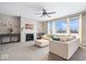Spacious living room with a cozy fireplace, large windows, and comfortable seating at 2449 Lingerman Way, Avon, IN 46123