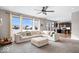 Open living room with a view of the kitchen and large windows at 2449 Lingerman Way, Avon, IN 46123