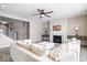 Living room with fireplace, large windows, and sectional sofa at 2449 Lingerman Way, Avon, IN 46123