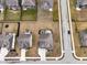 Aerial view of neighborhood showing backyards, including one with a fire pit at 4201 Risen Star Way, Bargersville, IN 46106
