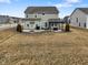 Large backyard showcasing a patio, pergola, and outdoor seating area, perfect for entertaining guests at 4201 Risen Star Way, Bargersville, IN 46106