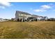 Spacious backyard featuring lush green grass and mature trees, perfect for outdoor activities at 4201 Risen Star Way, Bargersville, IN 46106
