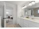 Bathroom with double vanity and view into bedroom at 4201 Risen Star Way, Bargersville, IN 46106