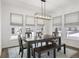 Bright dining room featuring a farmhouse table and natural light at 4201 Risen Star Way, Bargersville, IN 46106