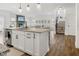 Open concept kitchen with island and view into living room at 4201 Risen Star Way, Bargersville, IN 46106
