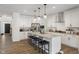 Modern kitchen with island, stainless steel appliances, and granite countertops at 4201 Risen Star Way, Bargersville, IN 46106