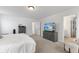 Bright main bedroom with large TV and ample closet space at 4201 Risen Star Way, Bargersville, IN 46106