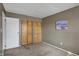 Bedroom featuring closet with bi-fold doors and neutral carpeting at 4814 Oakwood Trl, Indianapolis, IN 46268