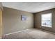 Well-lit bedroom offers neutral tones and comfortable carpeting at 4814 Oakwood Trl, Indianapolis, IN 46268