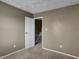 Bedroom featuring an open door and neutral decor at 4814 Oakwood Trl, Indianapolis, IN 46268