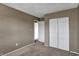 Bedroom view showcases a closet with double doors and neutral decor at 4814 Oakwood Trl, Indianapolis, IN 46268