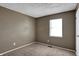 Bedroom with a window and neutral decor at 4814 Oakwood Trl, Indianapolis, IN 46268