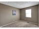 Neutral bedroom features a bright window and comfortable carpeting at 4814 Oakwood Trl, Indianapolis, IN 46268