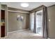 Light-filled dining room with sliding door to backyard and neutral decor at 4814 Oakwood Trl, Indianapolis, IN 46268