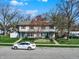 Two-story home with neat lawn and mature trees lining the streets in the neighborhood at 4814 Oakwood Trl, Indianapolis, IN 46268
