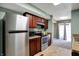 Modern kitchen features stainless steel appliances and dark wood cabinets at 4814 Oakwood Trl, Indianapolis, IN 46268