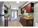 Spacious kitchen features stainless steel appliances, tile floors, and ample cabinet space at 4814 Oakwood Trl, Indianapolis, IN 46268